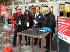 Salvation Army volunteers Sean and Laura join London Drugs store manager and Major Ken Ritson from the Salvation Army to launch pin pads donations.