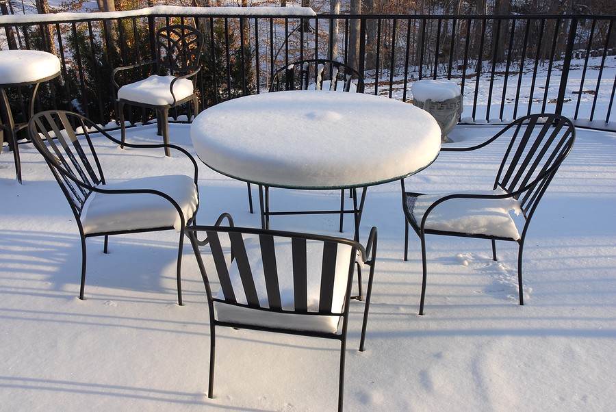 patio furnitures, iron chair and table after snow