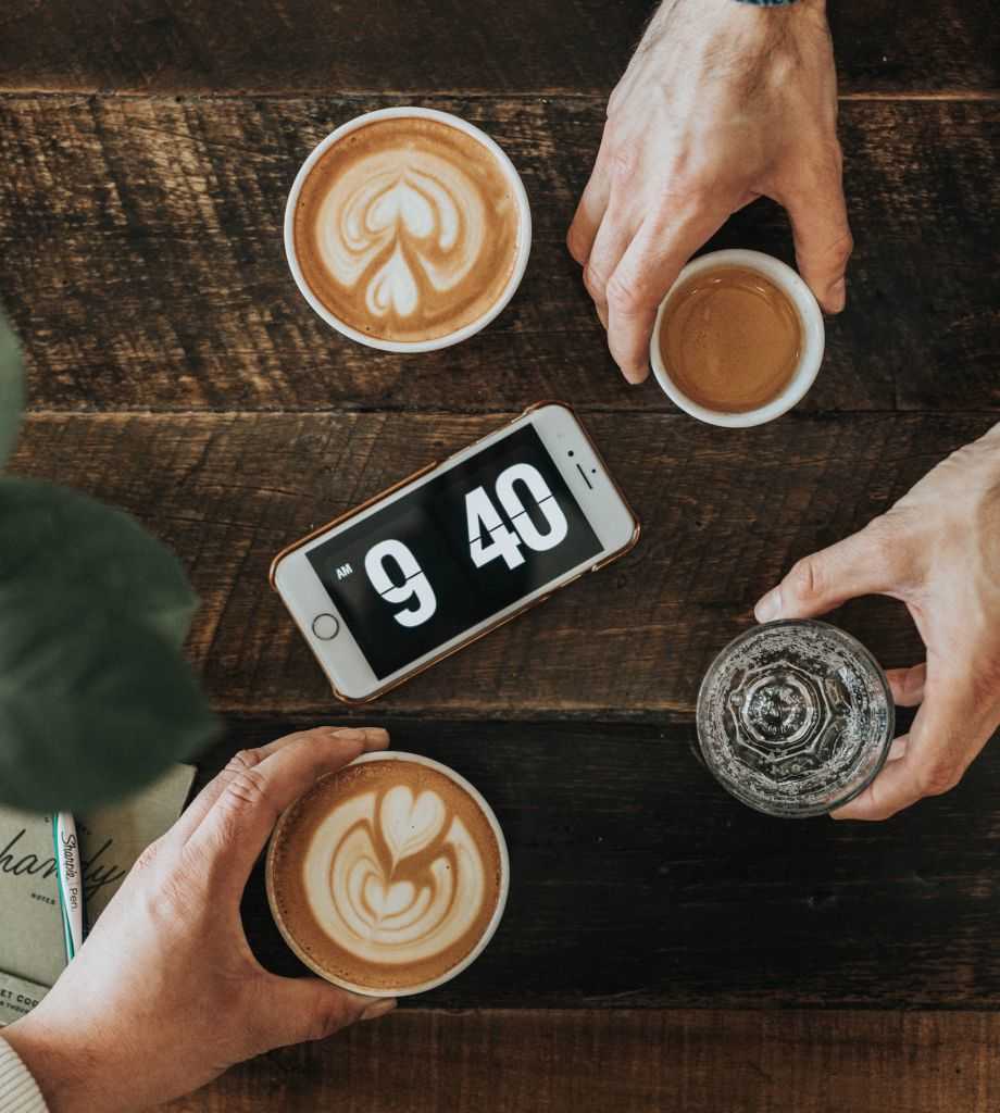 fika - coffee and an alarm clock on a table