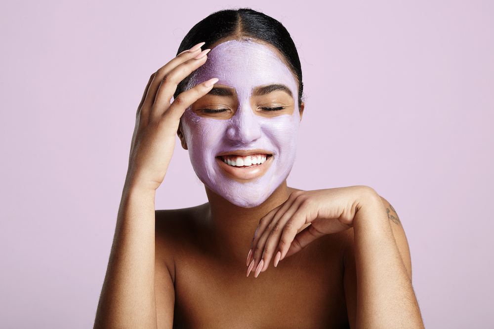 Woman smiling with face mask London Drugs Beauty